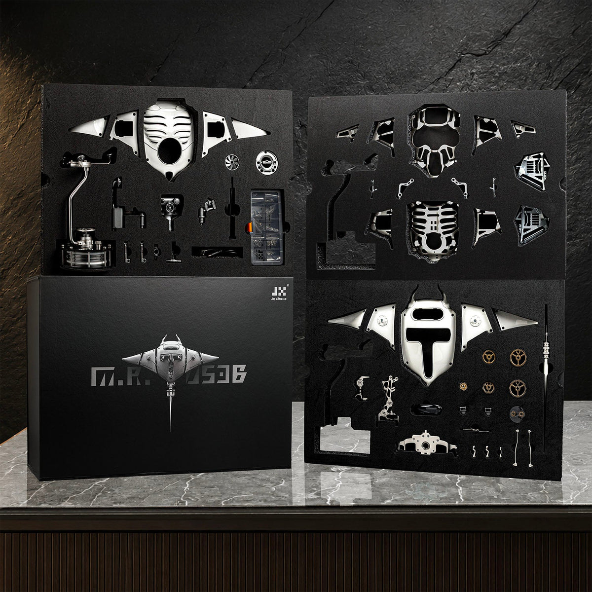 Mecha Ray White — the assembly kit laid out as cut component sheets with tools and fixings, kinetic sculpture by IFL Watches.