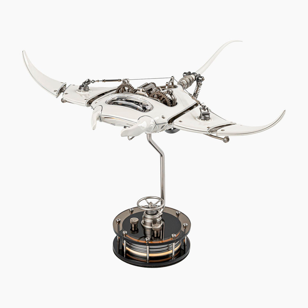 Mecha Ray White — motorised manta with wings swept wide and the gear train visible along its back, on a weighted drive base, kinetic metal sculpture by IFL Watches.