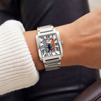 Festina Freedom 29 mm on wrist — custom rectangular dial with hand-painted “FREEDOM” graffiti text and orange brick-wall artwork on the Festina On The Square. Limited edition by IFL Watches.