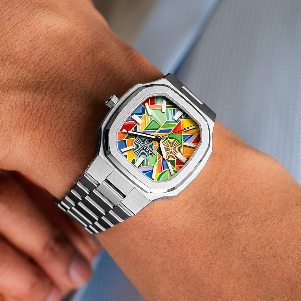 MAEN Manhattan Paradox on wrist — geometric color-block dial paired with the integrated steel bracelet, 37mm automatic with Sellita SW200-1, limited edition timepiece by IFL Watches.