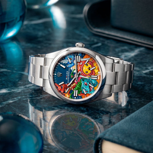 Dream Team Concept: Evolution — Hand-painted bespoke timepiece featuring four colorful pop art figures rendered in glittering mosaic-tile style on a blue 41mm custom automatic dial by IFL Watches