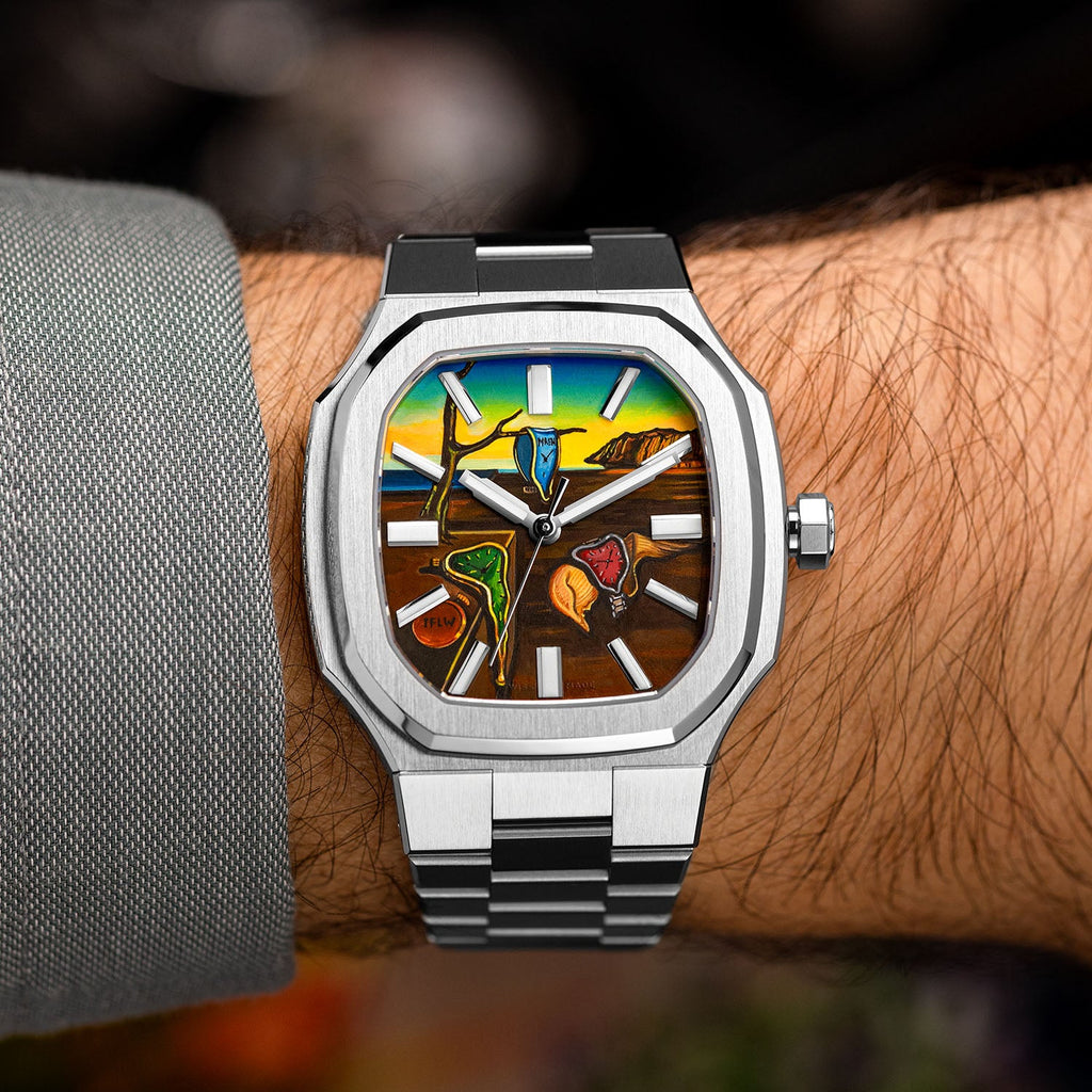 MAEN Manhattan Memento — Bespoke 37mm octagonal steel watch worn on the wrist, its hand-painted dreamlike landscape of soft watches and golden cliffs spread across the dial, customized exclusively by IFL Watches.
