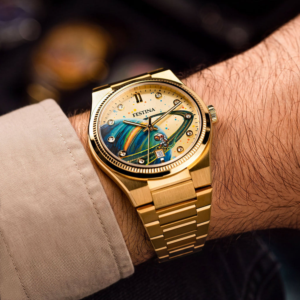 Festina Rive Space Ollie — Gold-tone case and integrated bracelet on the wrist, angled to show a hand-painted planet sweeping across the custom dial, a bespoke timepiece by IFL Watches.