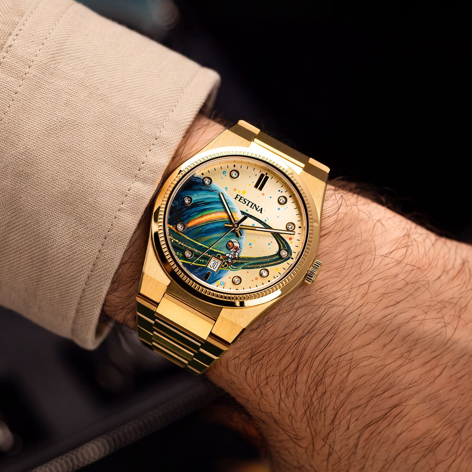 Festina Rive Space Ollie — Bespoke 40mm gold-tone watch worn on the wrist, its hand-painted planet and rider catching light across a sunburst dial, customized exclusively by IFL Watches.