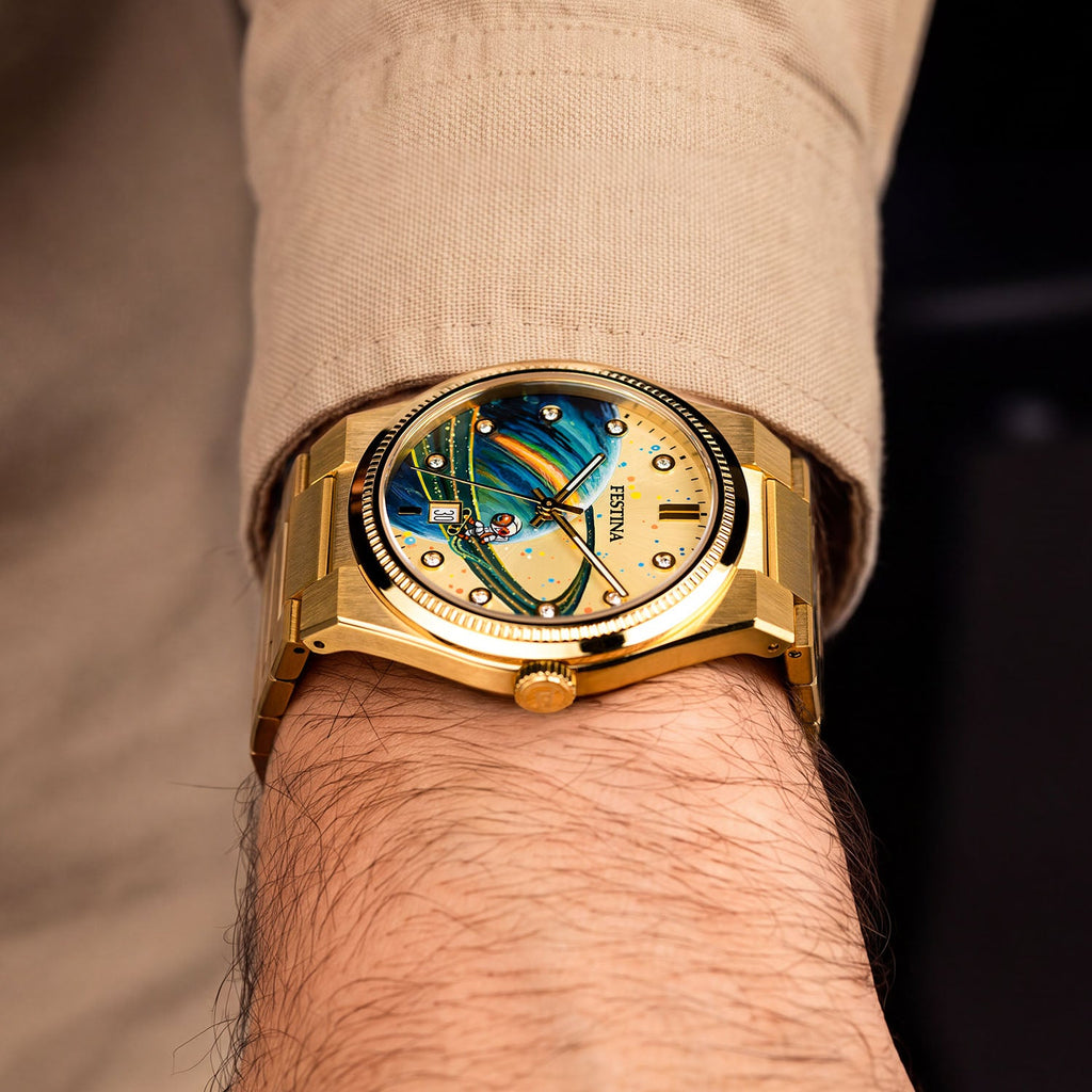 Festina Rive Space Ollie — Side profile at the wrist showing fluted bezel, crown and brushed gold links, with the hand-painted custom dial in view, a bespoke timepiece by IFL Watches.