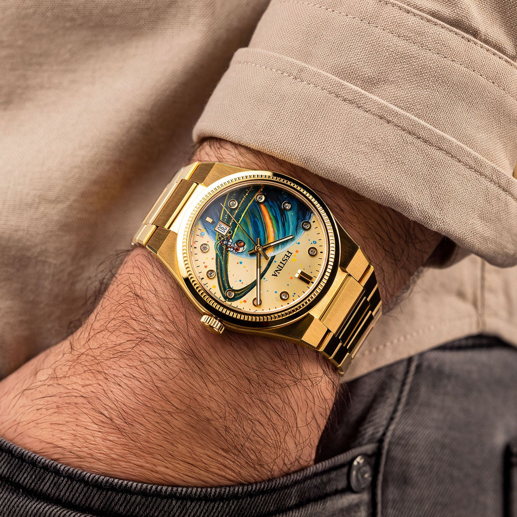 Festina Rive Space Ollie — Worn on the wrist and turned to show the bracelet, with a hand-painted planet and rider across the custom gold dial, a bespoke timepiece by IFL Watches.