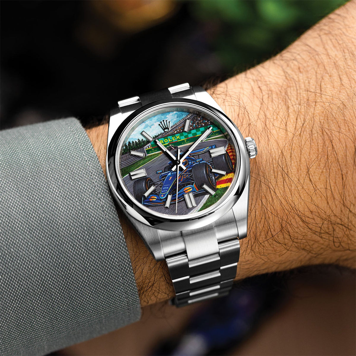Apex Concept — Hand-painted custom dial angled on the wrist, race car and packed grandstand under a clouded sky, a bespoke timepiece by IFL Watches.