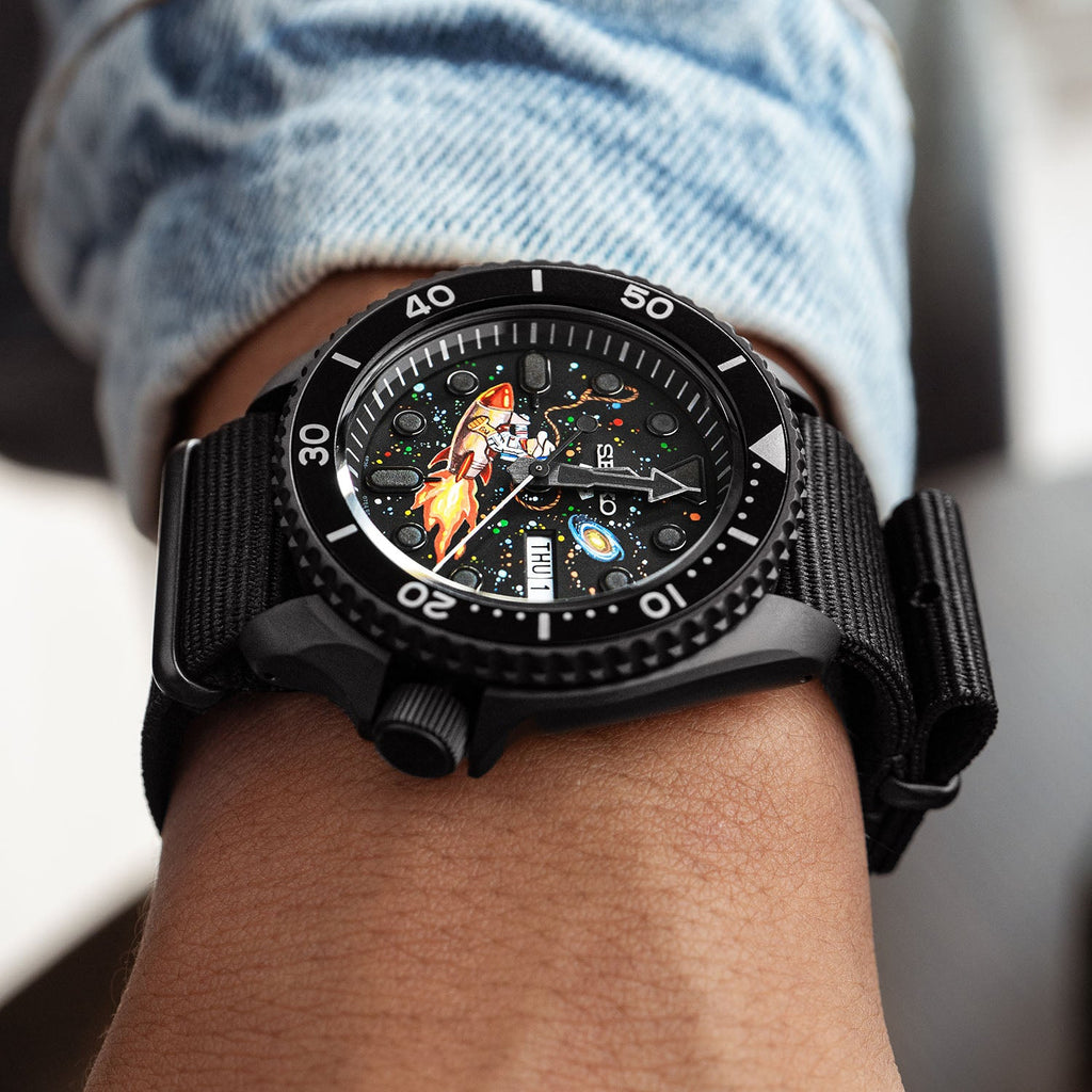 Space Cowboy Concept – Hand-painted custom Seiko 5 Sports featuring cosmic cowboy riding rocket through space, bespoke timepiece by IFL Watches