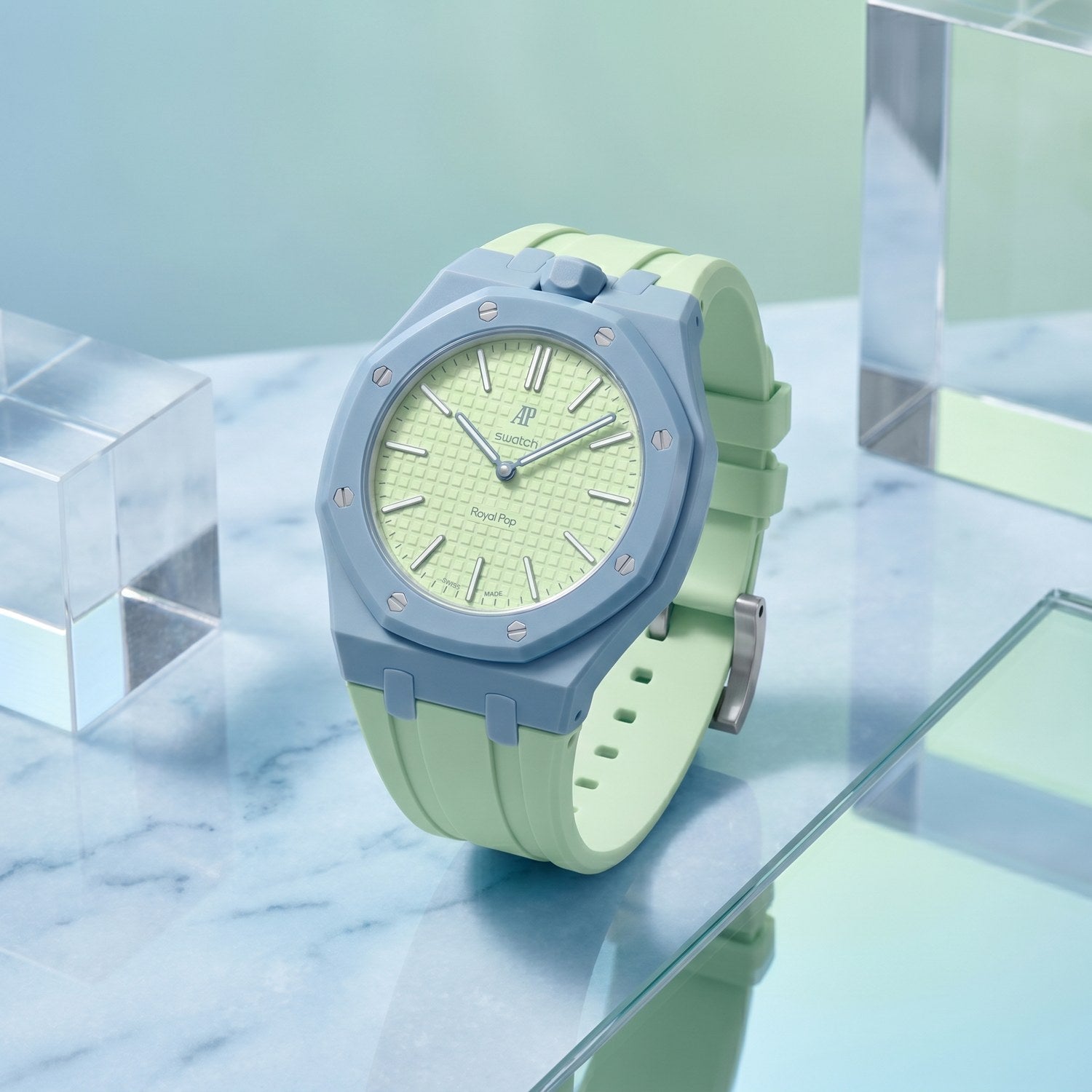 Blaue Acht Swatch × AP Royal Pop Rubber Case-Strap — on a tabletop, by IFL Watches