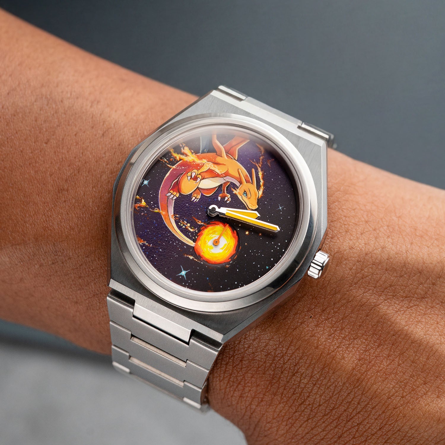 Defiant Inferno Concept on wrist — top-down view of the hand-painted fire-breathing icon on a cosmic black dial with a blazing orb in the small-seconds register, 40.5mm Super Titanium™ case, a bespoke timepiece by IFL Watches.
