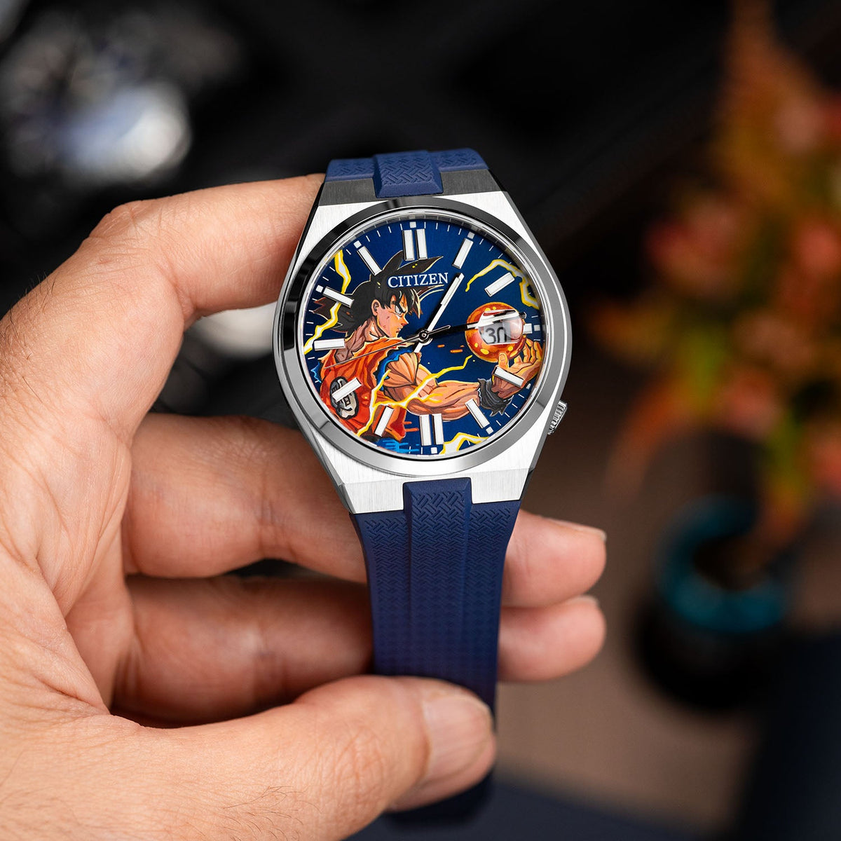 Citizen Tsuyosa Strap – Blue FKM strap on a hand-painted Citizen Tsuyosa by IFL Watches, held in the hand