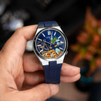 Citizen Tsuyosa Strap – Blue FKM strap on the hand-painted Time Is Money Concept by IFL Watches, held in the hand