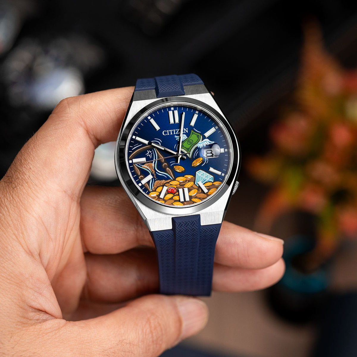 Citizen Tsuyosa Strap – Blue FKM strap on the hand-painted Time Is Money Concept by IFL Watches, held in the hand