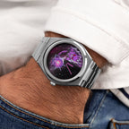 Defiant Shadow Concept — Hand-painted dial seen from above on the wrist, purple lume hands over a custom cosmic scene, a bespoke timepiece by IFL Watches.
