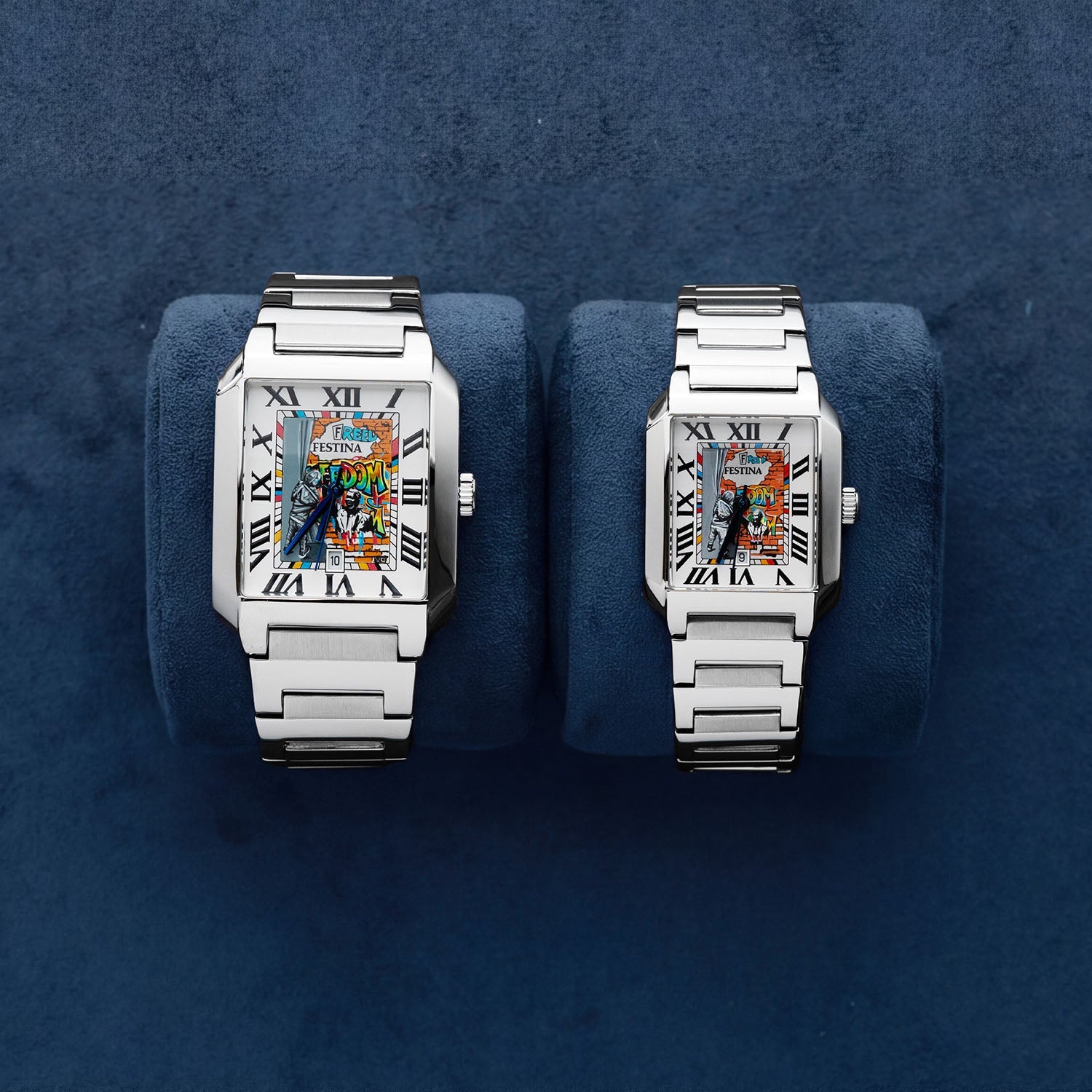 Festina Freedom — 36 mm and 29 mm side by side on navy suede cushions, featuring hand-painted street-art dials with Roman numerals and integrated steel bracelets. Limited edition by IFL Watches.