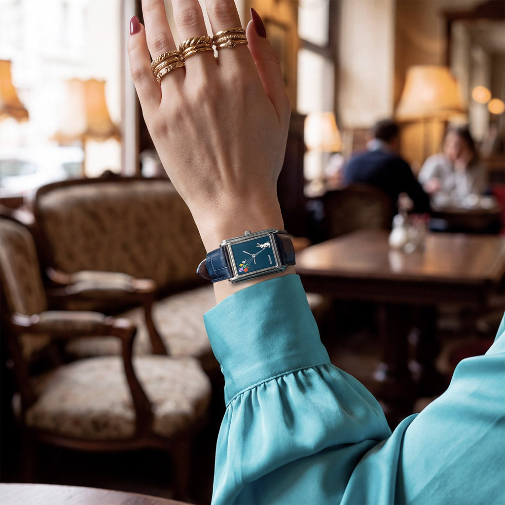 Laphont Bloc Skybound — Worn with a turquoise silk blouse and stacked gold rings in a warmly lit café, the navy dial on a croc-embossed strap, a hand-painted limited edition timepiece by IFL Watches