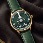 Mandetbrote Orbital Bronze Crush — Resting on dark fabric, showing the bronze case and crown, available at IFL Watches.