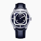 Mandetbrote Orbital II Blue — Front view of the blue aventurine glass dial with cushion-shaped hour rail, geared satellite and central minute hand, 40mm steel case on blue leather strap, available at IFL Watches.