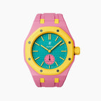 OTG Roz Swatch × AP Royal Pop Rubber Case-Strap — playful pink-and-teal with a yellow bezel kit with the Royal Pop head seated in the case, by IFL Watches