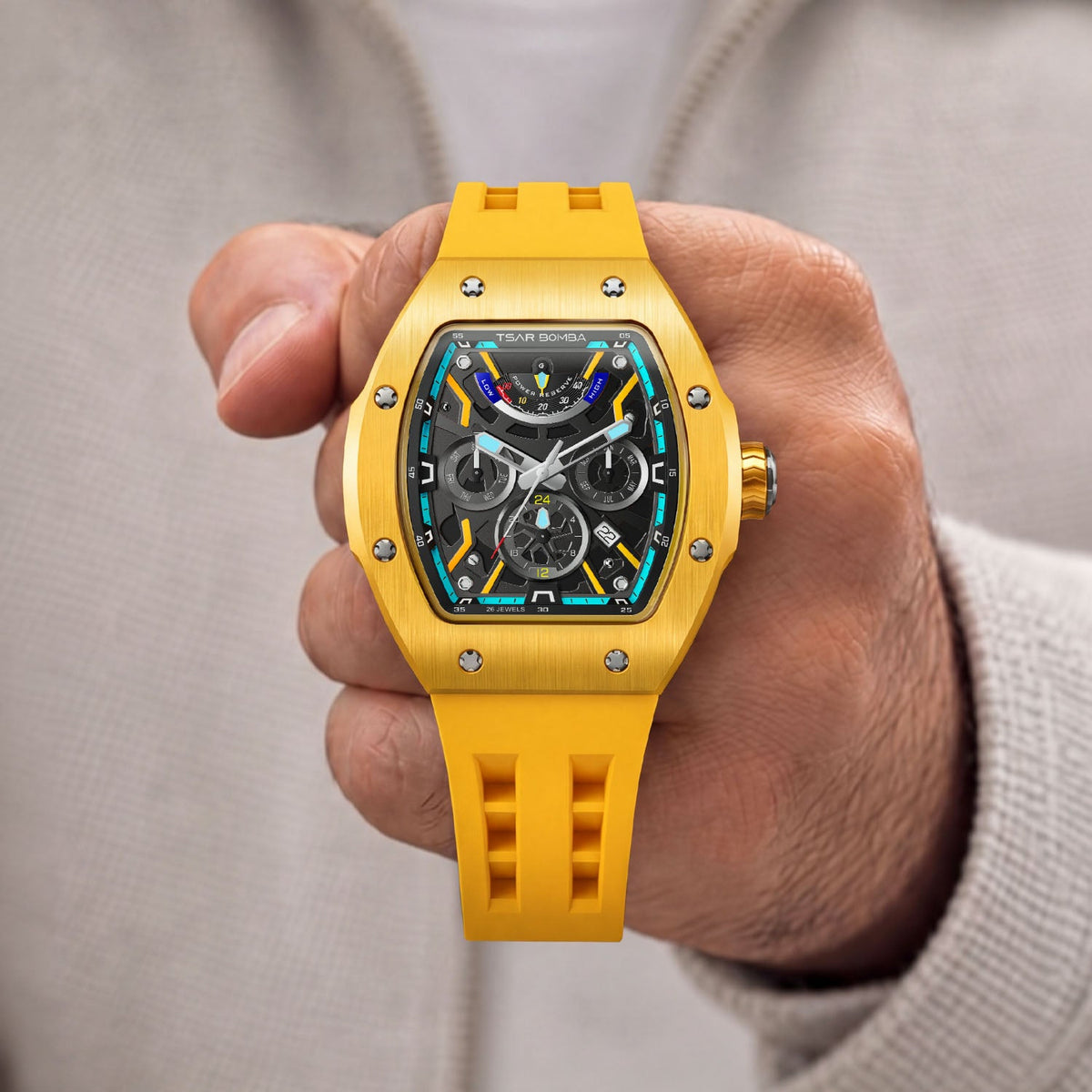 Tsar Bomba Atomic Yellow — Held in hand, showing the open-worked dial and screwed bezel, available at IFL Watches.