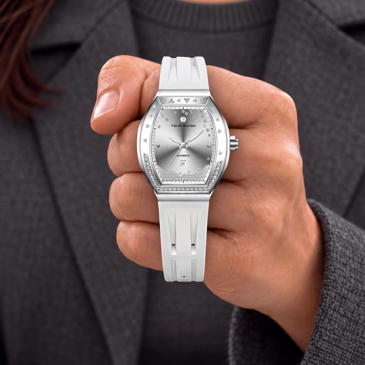 Tsar Bomba Lumina White Silver — Held in hand, showing the diamond-set bezel, available at IFL Watches.