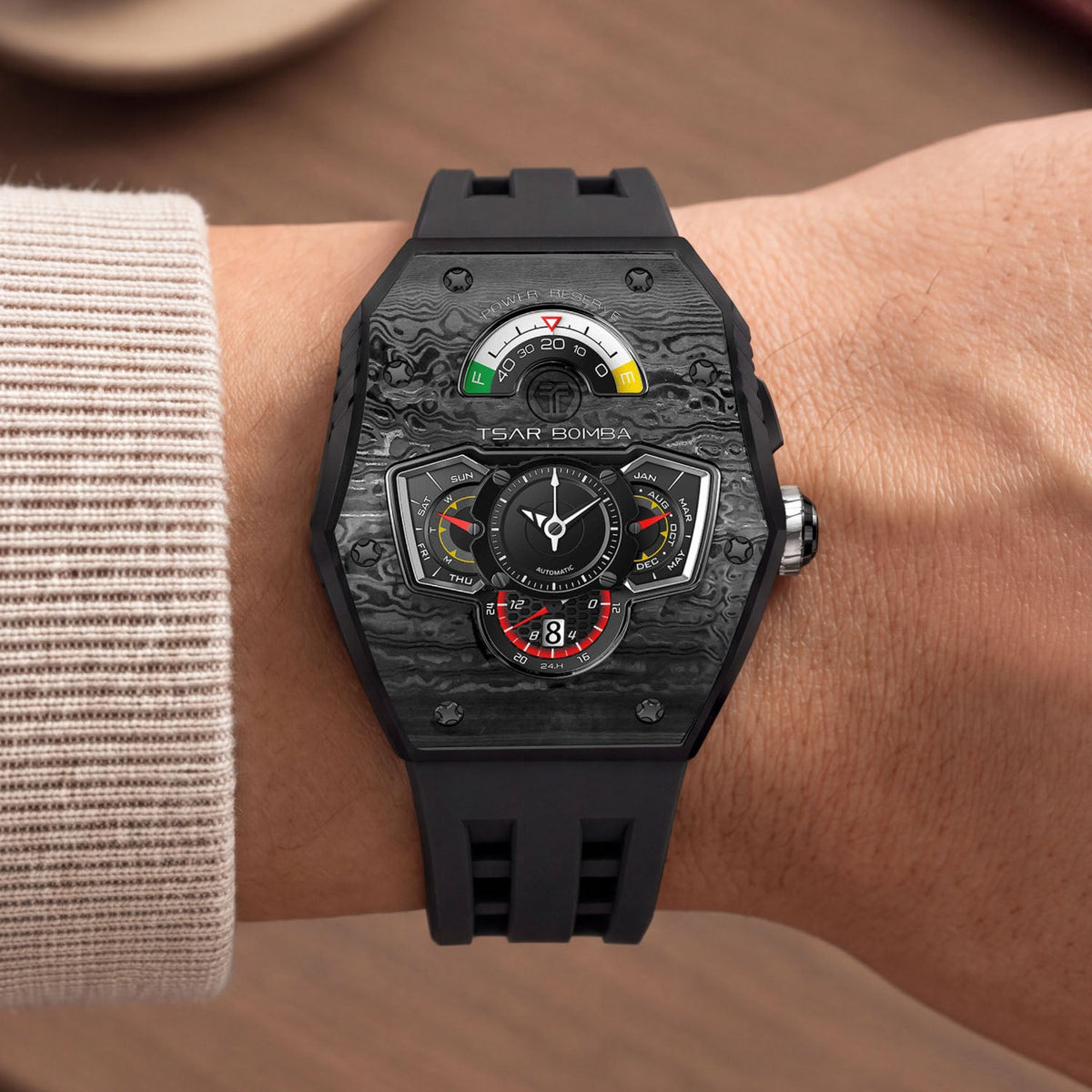 Tsar Bomba Parallax Carbon Black — Worn on wrist with a knit sleeve, showing the tonneau case, available at IFL Watches.